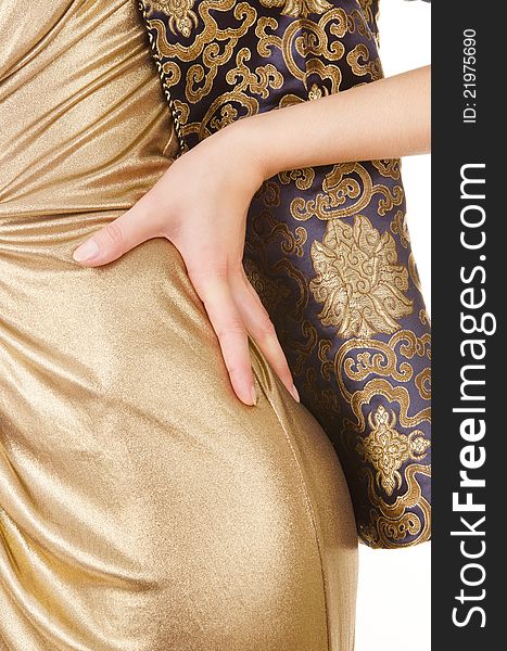 Folds gold fabric closeup, thigh and arm women
