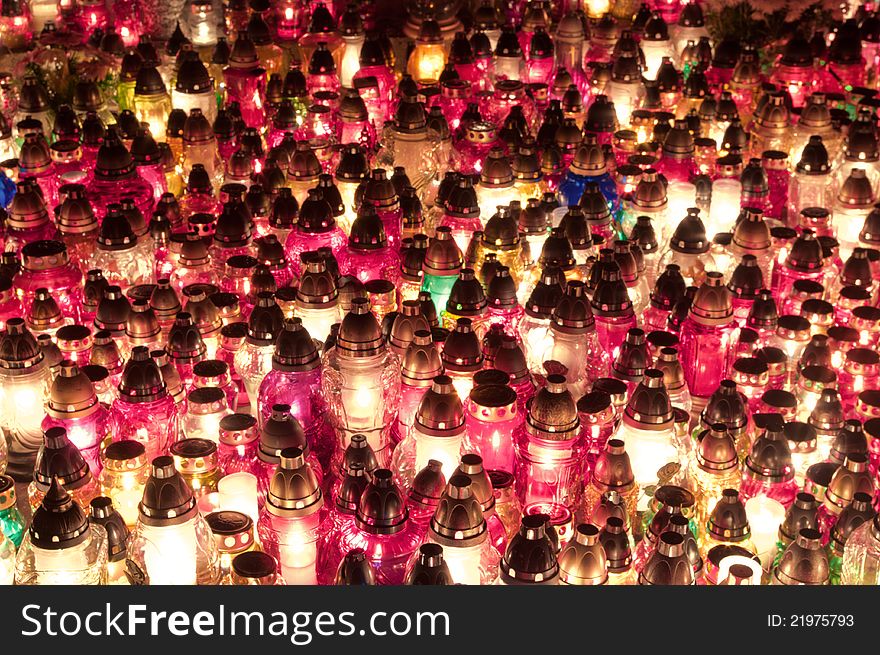 Candles arranged on the ground in the feast of all saints.