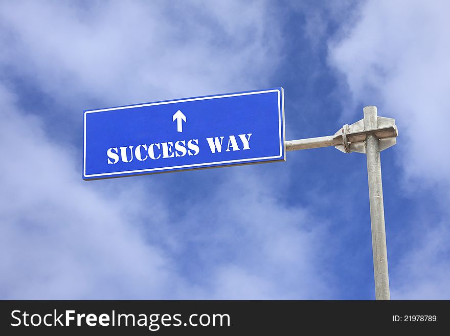 A photo of a success theme sign post against blue sky. A photo of a success theme sign post against blue sky