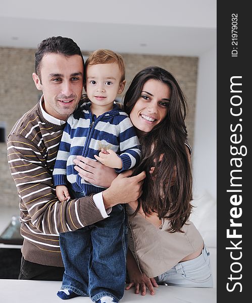 Happy young family have fun and relaxing at new home with bright furniture. Happy young family have fun and relaxing at new home with bright furniture