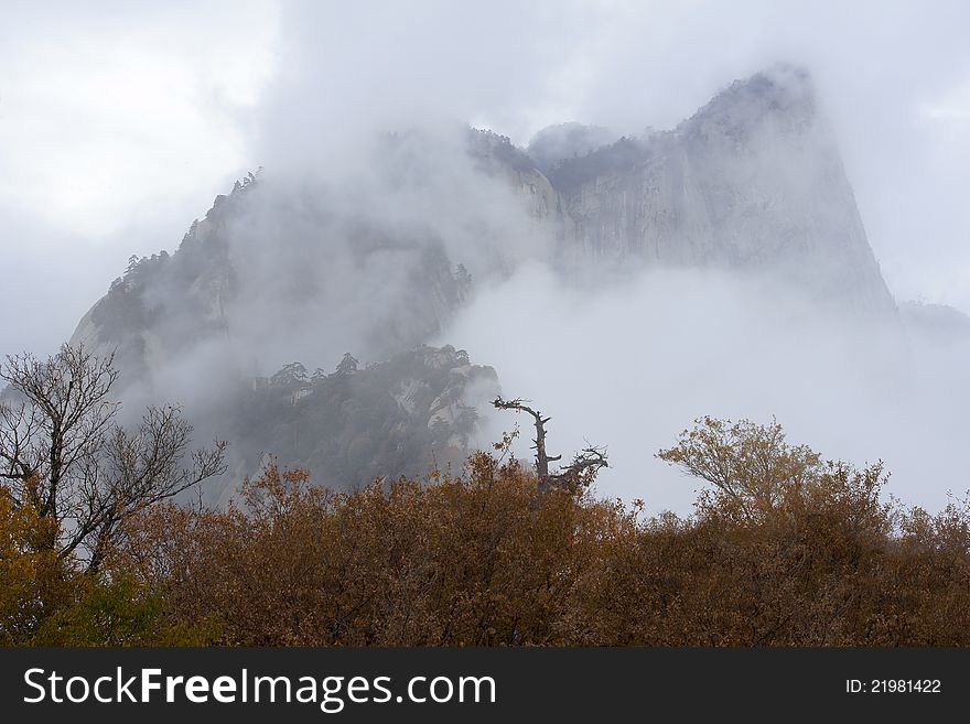 The peak of Mount Hua(Huashan) in the clouds. Huashan is one of the most perilous tourist attractions in china. Huashan is located in Huayin, Shannxi, China.