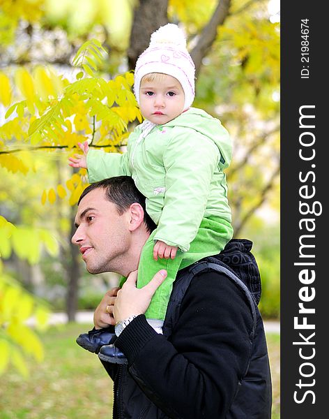 Small Beautiful Girl In Green Suit With Father