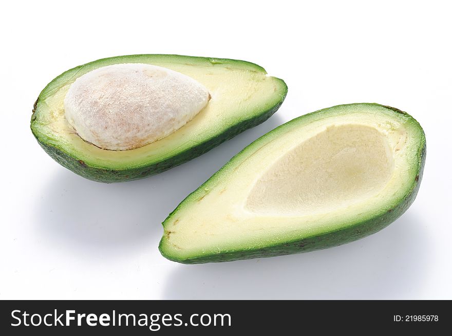 Avocado half on white background