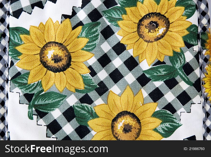 Sunflowers pattern on kitchen mitt background. Sunflowers pattern on kitchen mitt background