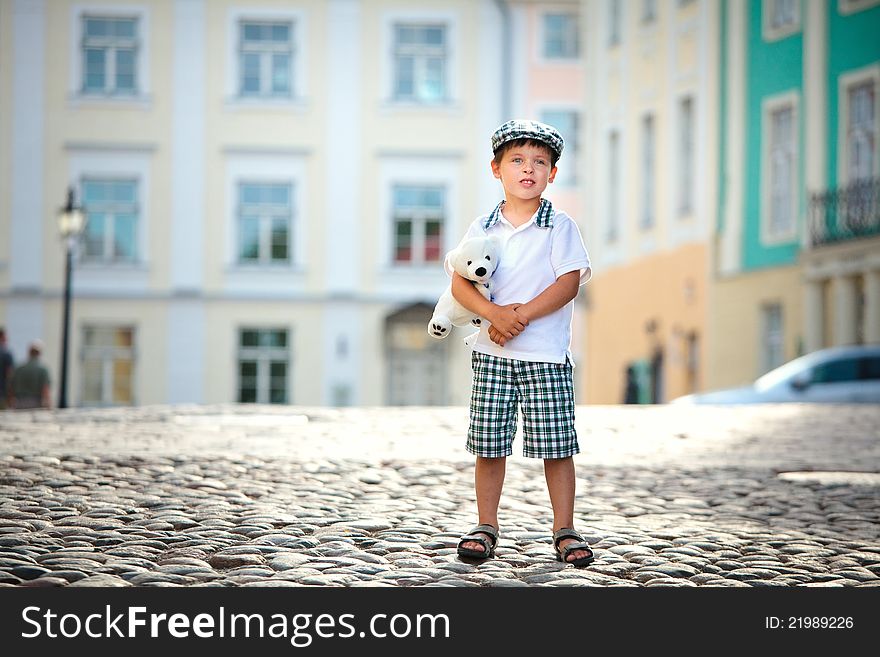 Portrait Of A Little Boy Outdoors In City