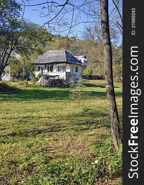 Generic transylvania rural household with old house and haycock