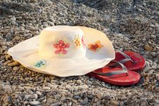 Hat And Flip-flops On The Stones Royalty Free Stock Photo Hat And Flip-flops On The Stones Royalty Free Stock Photo