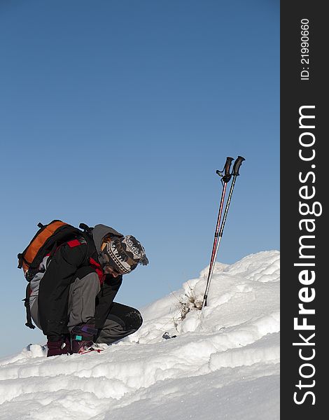 Young Man Preparing For Ski