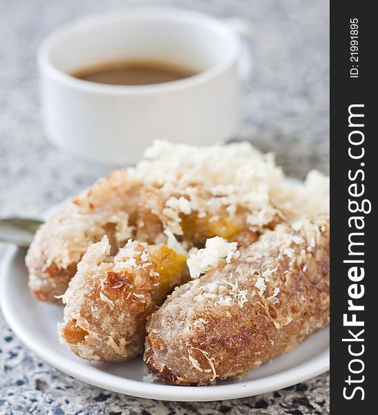 Fried bananas and a cup of coffee