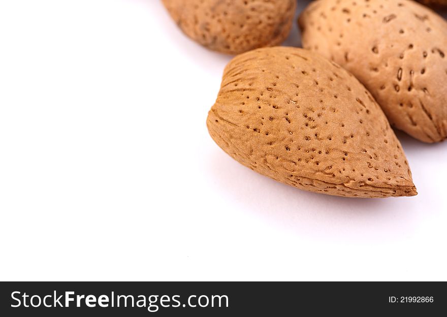 almonds nuts in macro isolated over white. almonds nuts in macro isolated over white