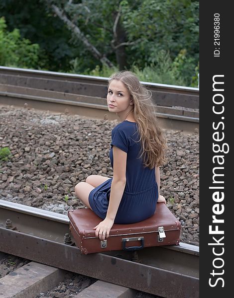 Woman Sitting On Rails