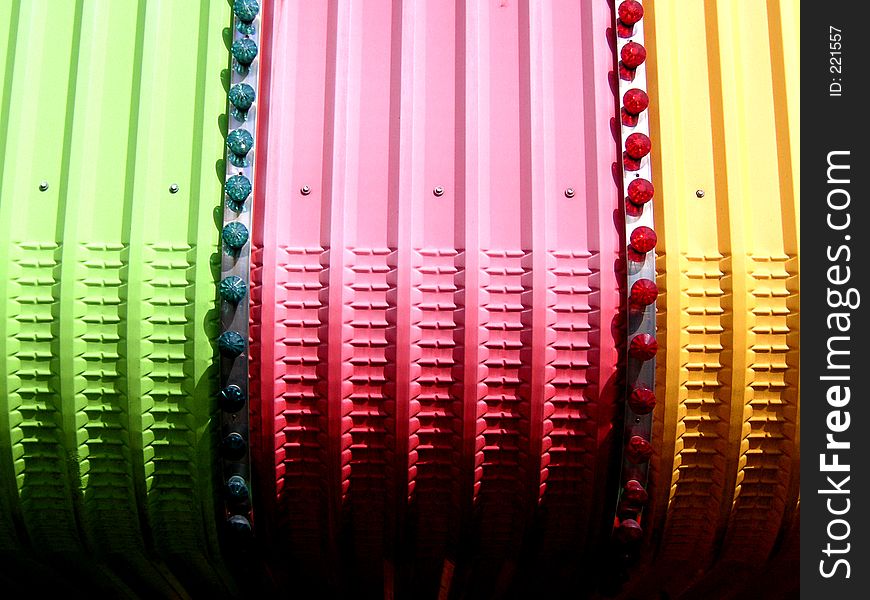 Details of the top of a fairground ride showing shape and colour. Details of the top of a fairground ride showing shape and colour