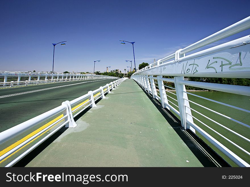 Abstract Bridge over main Guadalquivir river in Seville, southern Spain with converging lines. Abstract Bridge over main Guadalquivir river in Seville, southern Spain with converging lines