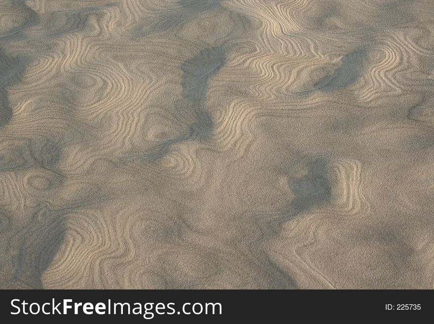 Patterns in the sand made by the wind. Patterns in the sand made by the wind