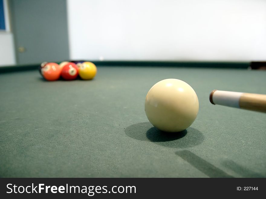 Nine ball showing cue stick and cue ball