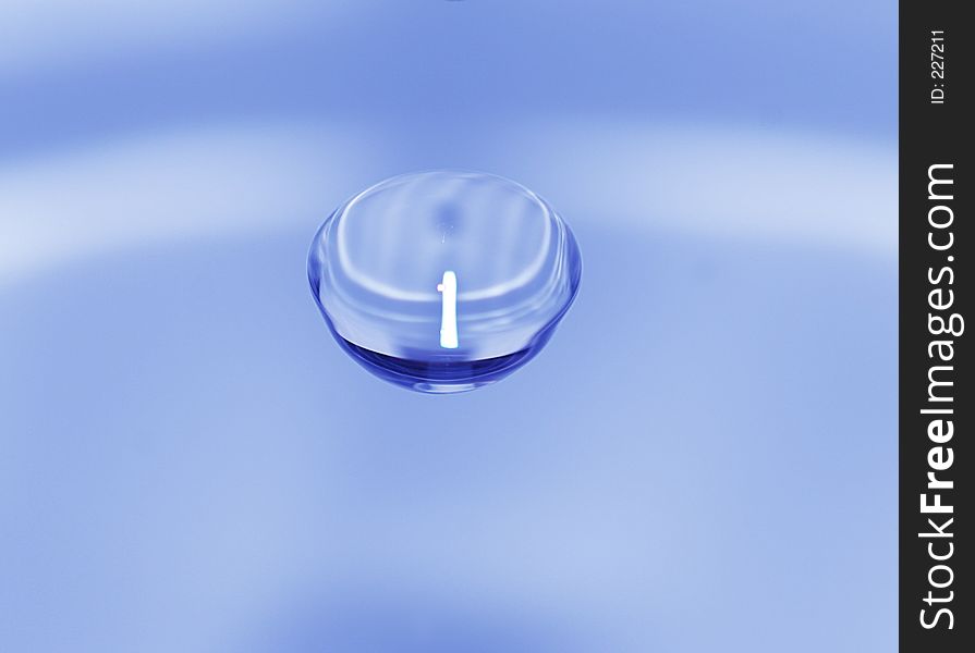 Water drop over blurred background