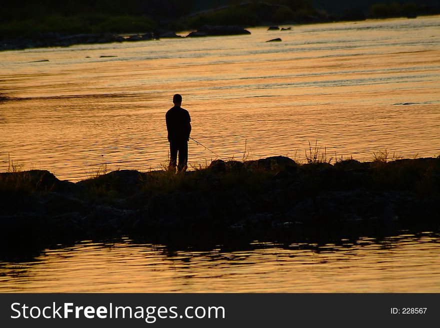 Fisherman and sunset