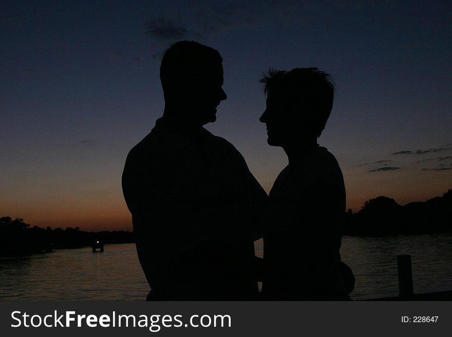 Sillhouette Of Man And Wife At Sunset