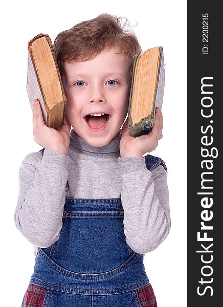 The boy with books smiles