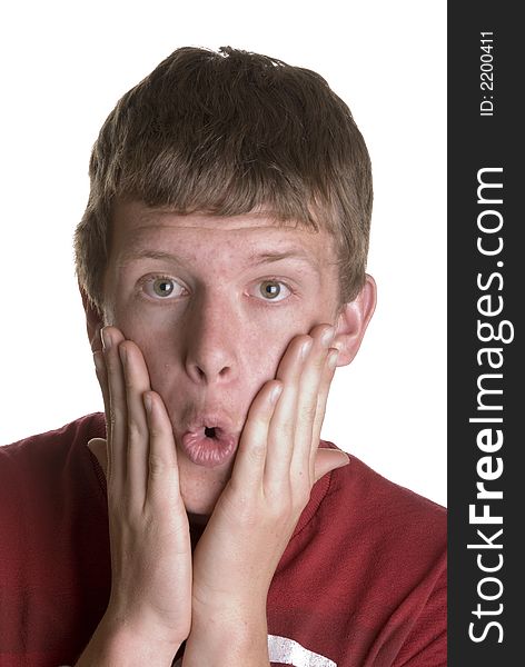 Young male teenager wearing red shirt with surprised facial expression. Young male teenager wearing red shirt with surprised facial expression