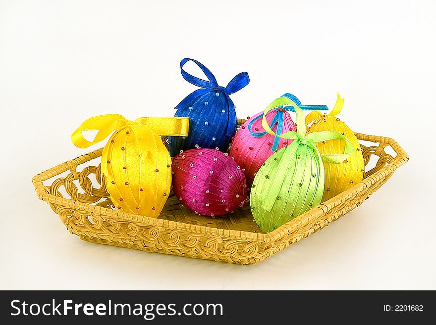 Basket with easter eggs on a light background