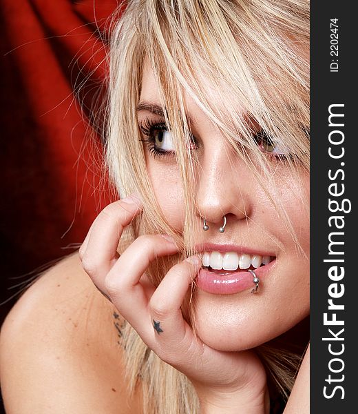 Beautiful blonde model with tattoos in studio. Beautiful blonde model with tattoos in studio