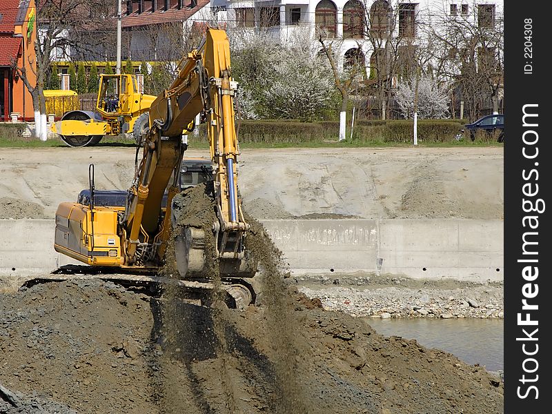 Excavator in action at the construction site.