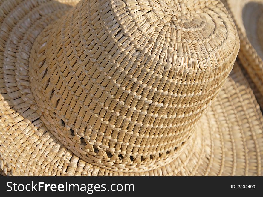 Detail image of a straws hat. Detail image of a straws hat.