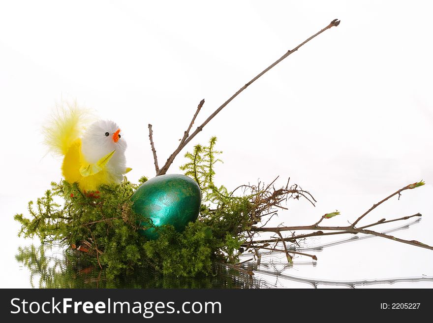 Coloured easter eggs in a jack from a moss and branches. Coloured easter eggs in a jack from a moss and branches