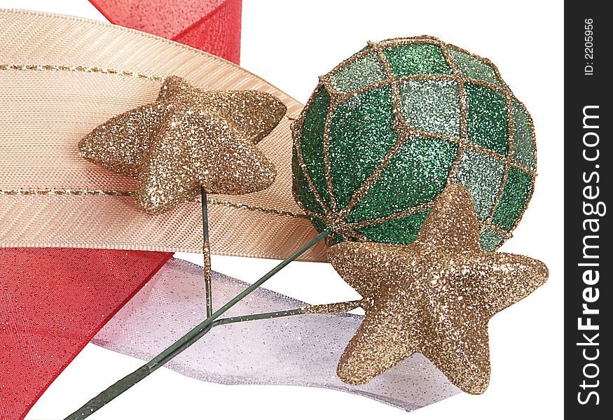 Glitter covered gold stars and green bauble ball stand out with gold, red and silver decorative ribbons, isolated on white background. Glitter covered gold stars and green bauble ball stand out with gold, red and silver decorative ribbons, isolated on white background.