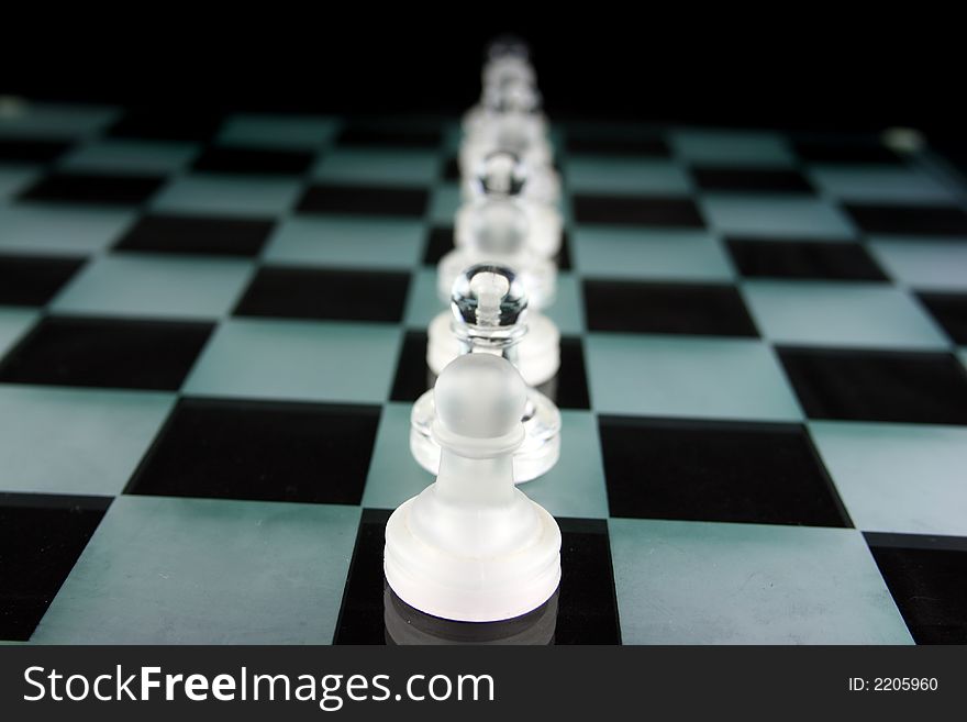 Chess Game - Chess Pieces on a glass chessboard. Chess Game - Chess Pieces on a glass chessboard