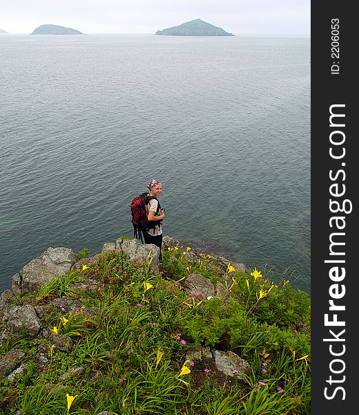 Hiking Girl On The Ocean Rock