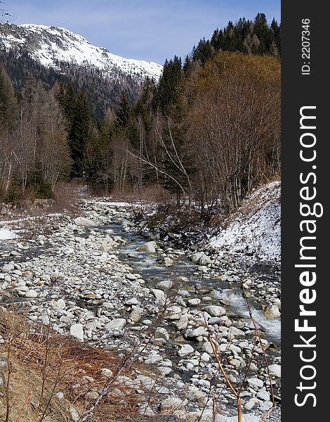Breathtaking Snowy mountains landscape with flowing river. Breathtaking Snowy mountains landscape with flowing river