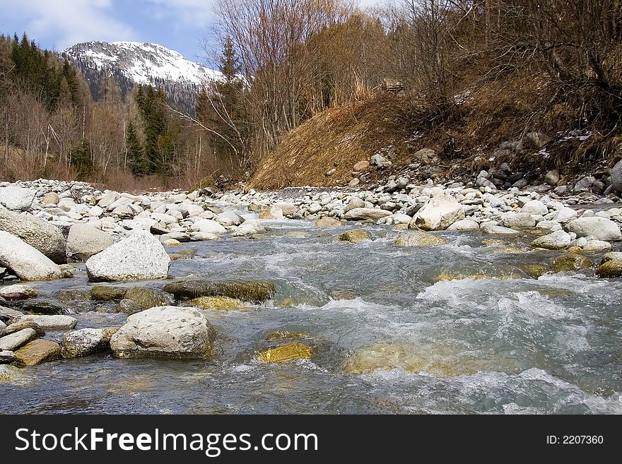 Breathtaking Snowy mountains landscape with flowing river. Breathtaking Snowy mountains landscape with flowing river