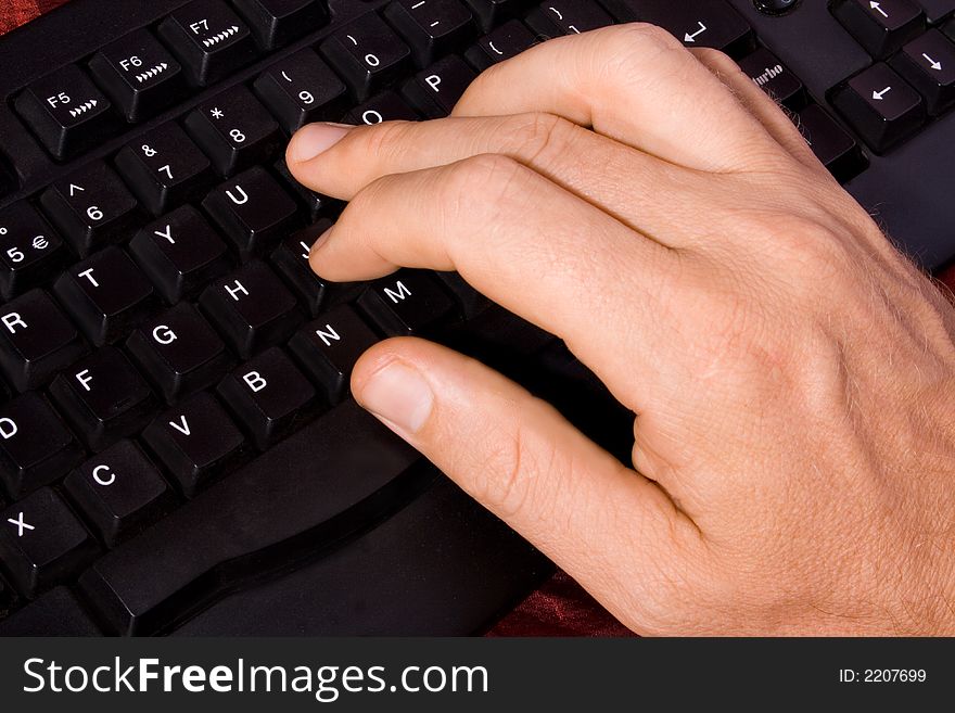 A nice well lit close up of a caucasian hand of a man on a black keybord of a PC. A fresh concept taken from above left. A nice well lit close up of a caucasian hand of a man on a black keybord of a PC. A fresh concept taken from above left.