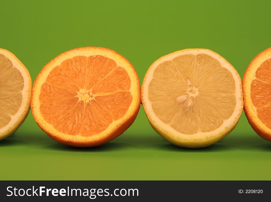 Oranges and Citrons on green background