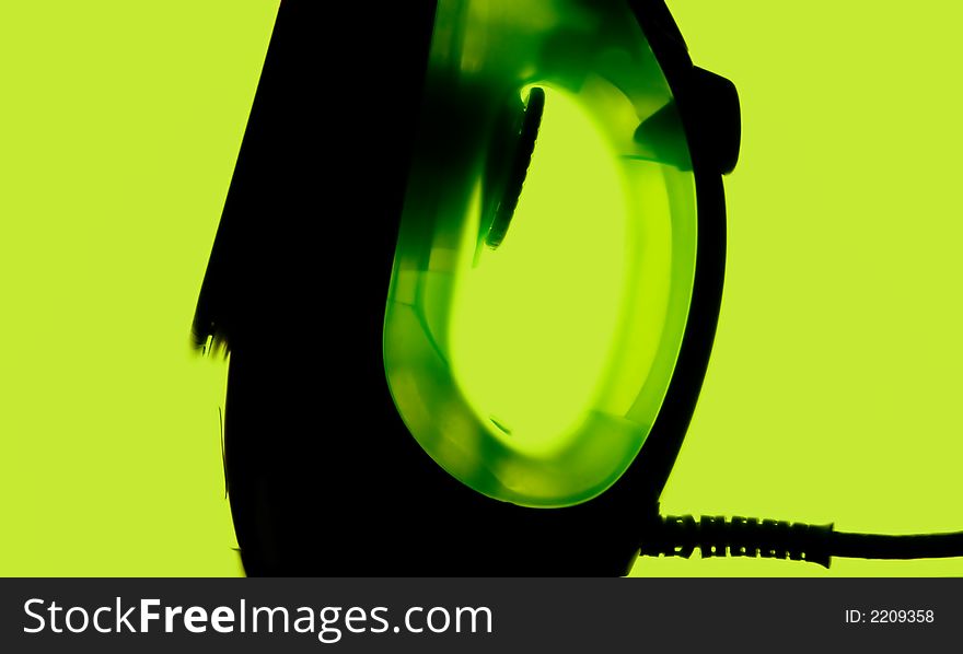 Dark green iron on green background