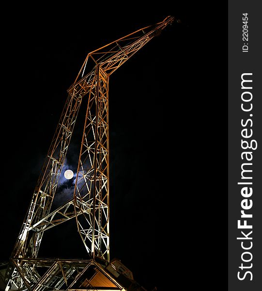 Crane at night at full moon in Buenos Aires. Crane at night at full moon in Buenos Aires