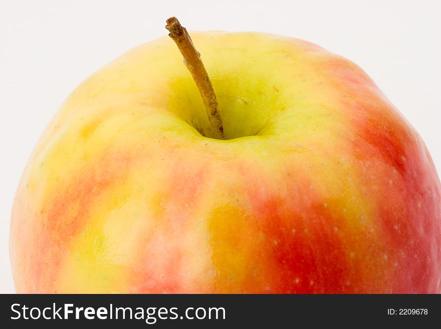 Close-up of a Pink Lady apple with stem