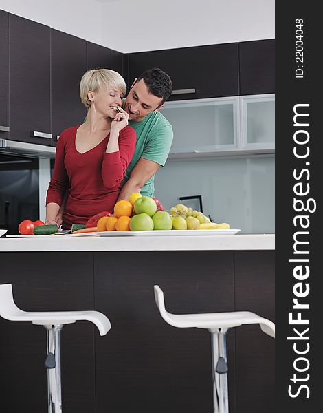 Young Couple Have Fun In Modern Kitchen
