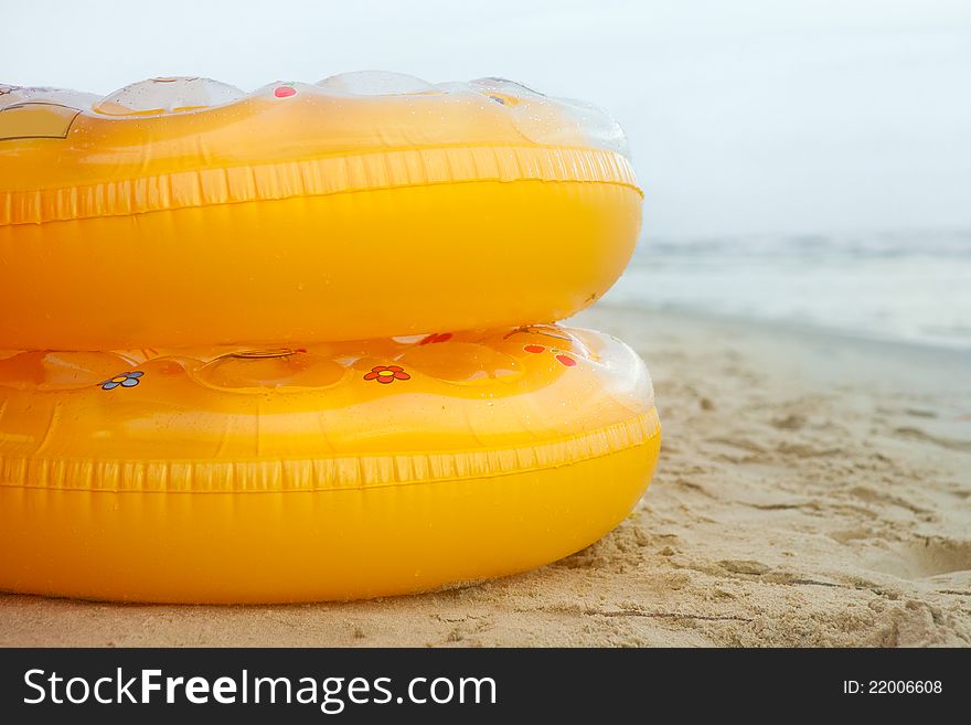 Child's swim ring on the beach