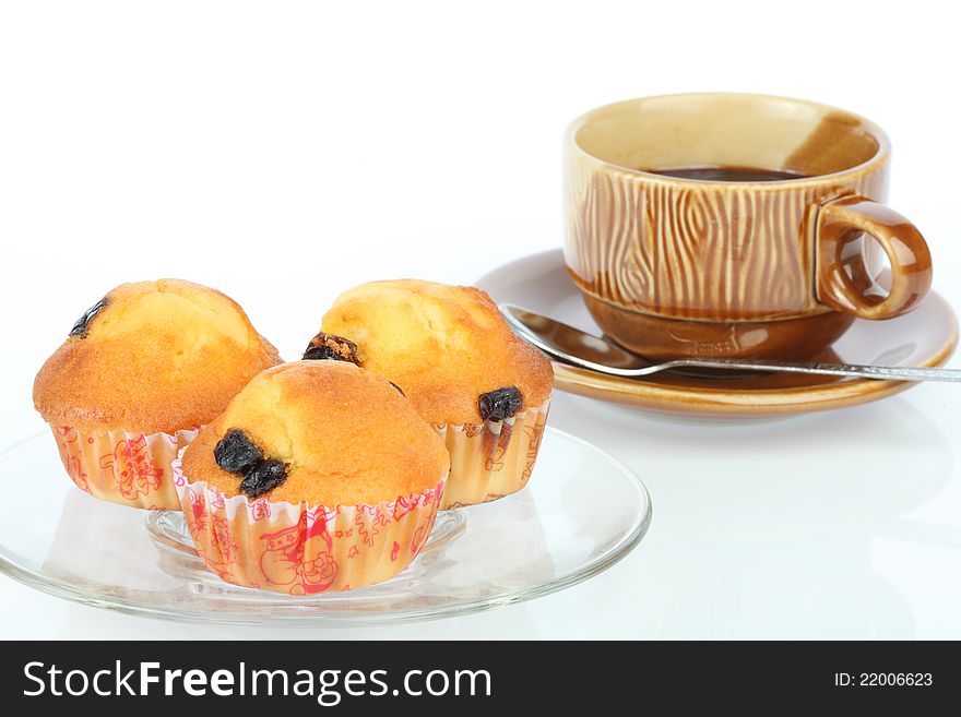 Muffin raisin and coffee on white background