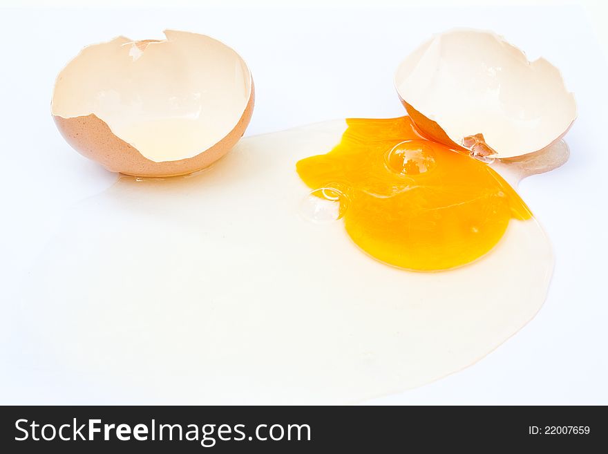 The falling egg on white background