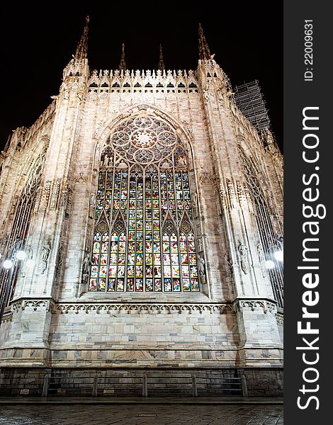 Illuminated stained glass windows after they've been recently renewed in main gothic cathedral in Milan. Illuminated stained glass windows after they've been recently renewed in main gothic cathedral in Milan