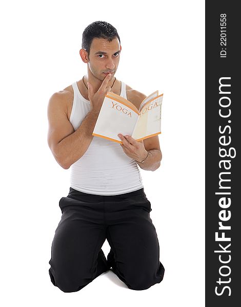 Personal trainer reading a yoga book. Personal trainer reading a yoga book