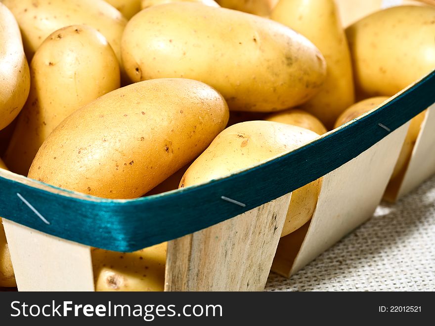 Fresh tasty potatoes into the box