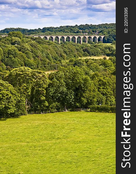 Stone viaduct crossing a welsh valley surrounded by trees and fields. Stone viaduct crossing a welsh valley surrounded by trees and fields