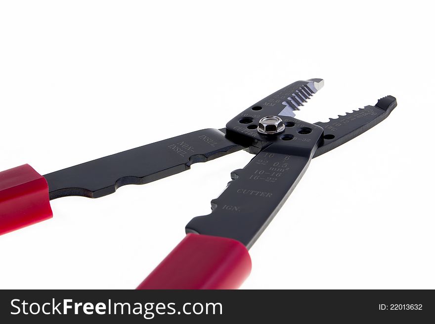 Red scissors for wires isolated on white background