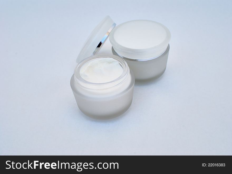 Containers of cosmetic face cream close-up. Containers of cosmetic face cream close-up
