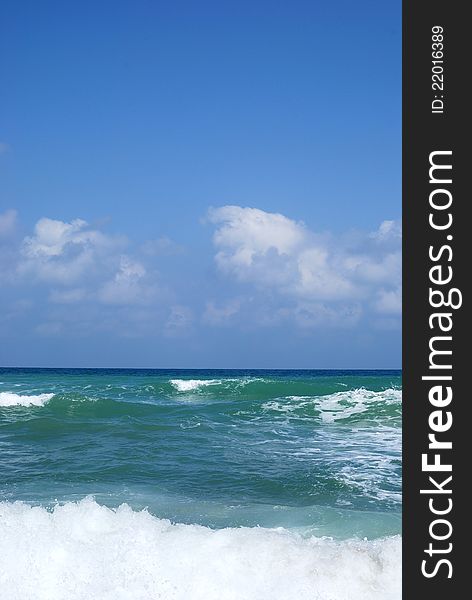 Running waves under the blue sky. Mediterranean sea.